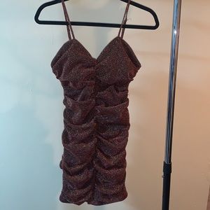 Sparkly dress with thing strips. Size medium.
